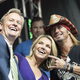 Nauert (center) poses for selfies with co-host Steve Doocy and Bret Michaels. (Debra L Rothenberg / Getty Images)